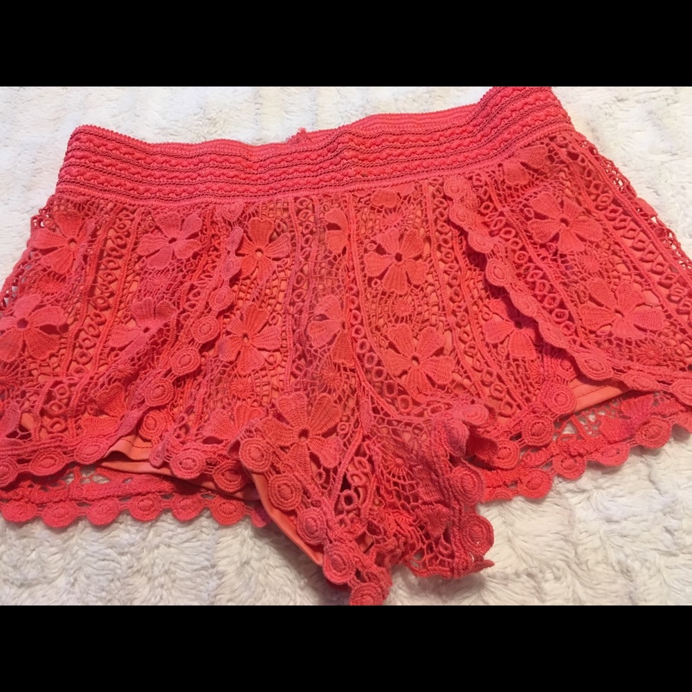 Orange shorts size large, almost famous